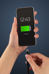 Elegant hand charging smartphone with low battery