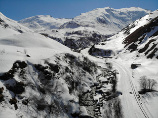 scenic view of snow covered mountains against sky