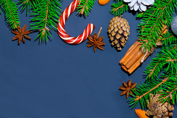 Christmas background. Upper, above, top view, of pine and spruce, evergreen, paper presents and Christmas red toys, with free space for text writing.