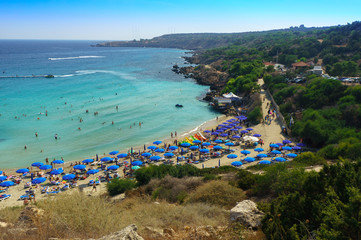 People at the famous beach of Konnos Bay Beach, Ayia Napa. Famagusta District, Cyprus. Best beaches of Cyprus - Konnos Bay in Cape Greko national park