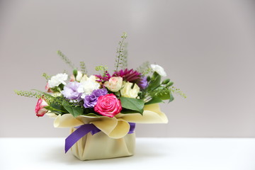 flower arrangement on gray background with copy space