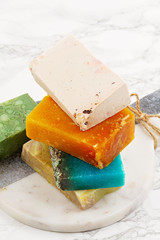 Handmade natural soap, eco friendly spa, beauty skincare concept. Small business, ethical shopping idea. Soap and dry shampoo bars packed in plastic free