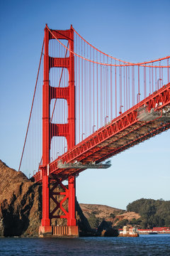 Golden Gate Bridge vertical photo taken from the ferry under the bridge. Famous tourist attraction in San Fransisco City.