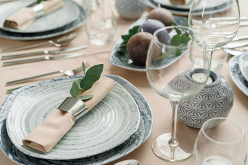Luxury table setting for dining in pastel colors close up