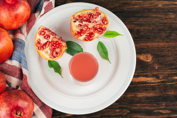 Cut pomegranate fruit on a wooden board
