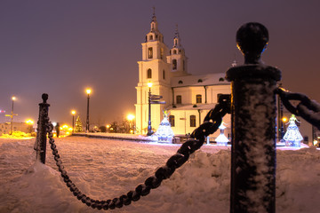 Fototapeta premium Minsk, Belarus. Night landscape of Minsk city in christmas nights. The main church in down town of Minsk