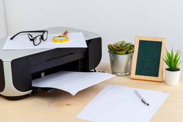 Office printer close up on a wooden table