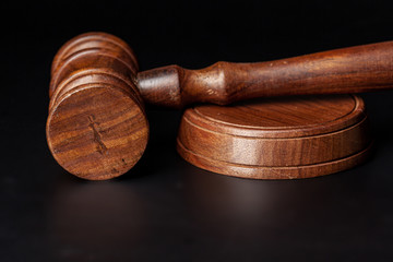 Wooden judges gavel on table close up