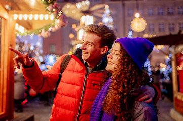 Young couple on Christmas market in Wroclaw, Poland