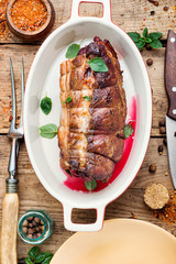 Baked meat on a wooden background