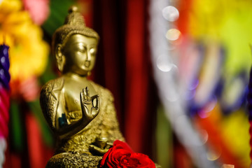 Fototapeta premium Lord Buddha sculpture with candle 