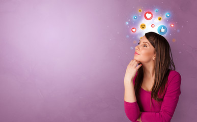 Business person standing with social media and emoticons concept