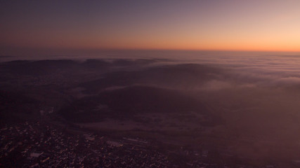 Sunset over the clouds taken by drone. Hesse, Germany