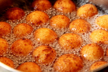Cottage cheese balls. Small balls of freshly baked homemade cottage cheese fried hot oil. Freshly made donuts from cottage cheese