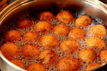 Cottage cheese balls. Small balls of freshly baked homemade cottage cheese fried hot oil. Freshly made donuts from cottage cheese
