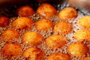 Cottage cheese balls. Small balls of freshly baked homemade cottage cheese fried hot oil. Freshly made donuts from cottage cheese