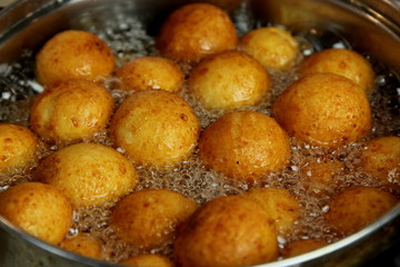 Cottage cheese balls. Small balls of freshly baked homemade cottage cheese fried hot oil. Freshly made donuts from cottage cheese