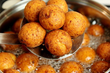 Cottage cheese balls. Small balls of freshly baked homemade cottage cheese fried hot oil. Freshly made donuts from cottage cheese