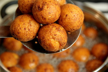 Cottage cheese balls. Small balls of freshly baked homemade cottage cheese fried hot oil. Freshly made donuts from cottage cheese