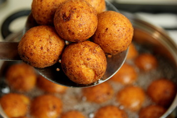 Cottage cheese balls. Small balls of freshly baked homemade cottage cheese fried hot oil. Freshly made donuts from cottage cheese