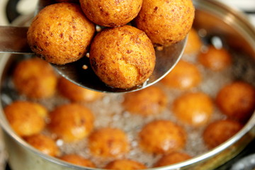 Cottage cheese balls. Small balls of freshly baked homemade cottage cheese fried hot oil. Freshly made donuts from cottage cheese