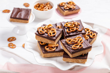 Chocolate Peanut Butter Bars topped with pretzels