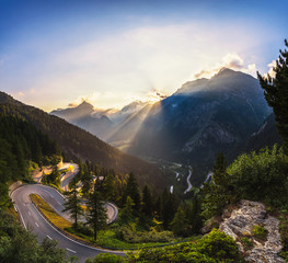 Maloja Pass road in Switzerland at sunset