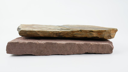 Fototapeta premium Stone overlap front blurred board empty table on White background, for product display, Blank for mockup design.
