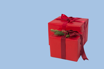 gifts in red packaging isolated blue on a background. packed boxes. Place for text
