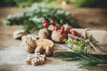 christmas cookies and decorations on wooden table