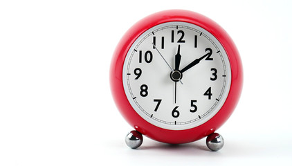 Red Alarm clock face beginning of time 12.10 on white background, Copy space for your text, Time concept.
