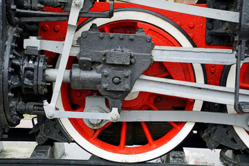 Details of the technique. Iron wheels of an old steam locomotive. Retro technique
