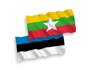 National vector fabric wave flags of Estonia and Myanmar isolated on white background. 1 to 2 proportion.