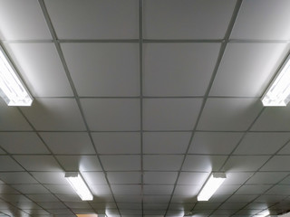 Long fluorescent light lamp under the ceiling In the building.