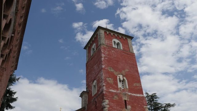 High bell tower over the entrance of Zica monastery in Serbia 4K tilting video