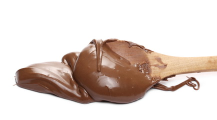 Cream chocolate spread with wooden spoon isolated on white background