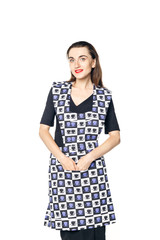 Beautiful woman in a black dress and a home apron for cleaning is isolated on a white background, one hand on the waist, 