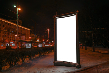 advertising construction of a pedestal in a city at night in winter. Ad design mocap with white field.