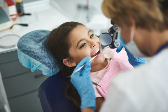 Smiling Girl Is Enjoying Visit To Dentist