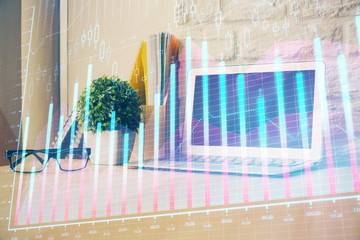 Financial graph colorful drawing and table with computer on background. Multi exposure. Concept of international markets.