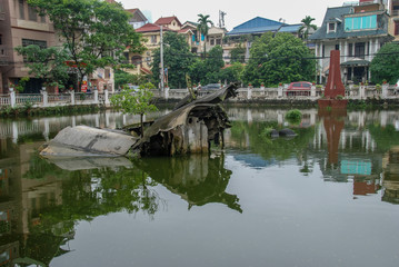 Fototapeta na wymiar Hanoi monument of B-52 wreckage from Vietnam War sunken in Huu Tiep Lake 