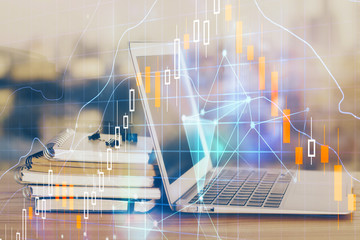 Financial market graph hologram and personal computer on background. Double exposure. Concept of forex.