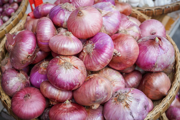 Full seed of red shallots in bracket close up.