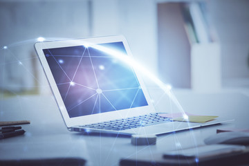 Computer on desktop with social network theme icon. Multi exposure. Concept of international connections.