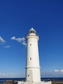 lighthouse with blue sky as background