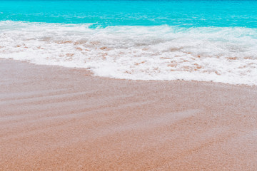 Fototapeta na wymiar beautiful sandy beach and soft blue ocean wave.