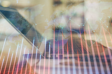 Forex graph hologram on table with computer background. Double exposure. Concept of financial markets.