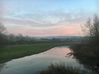 Fototapeta na wymiar sunrise over english river