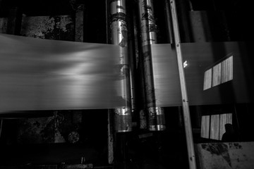 Black & White imagery of spool of plastic packaging sheet heavy duty for industrial use outdoors....