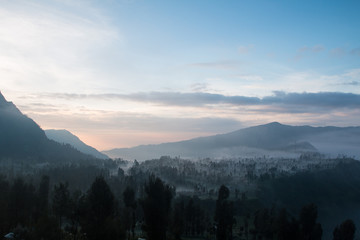 Fototapeta premium Volcano Bromo at sunset time background near Cemoro lawang village at mount Bromo in Bromo tengger semeru national park, East Java, Indonesia.